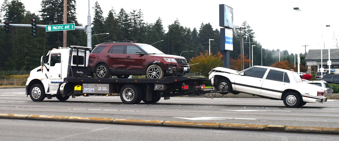 hero-gallery-02 a-tow-truck-towing-a-car-on-a-flatbed-q7shv9in7cc